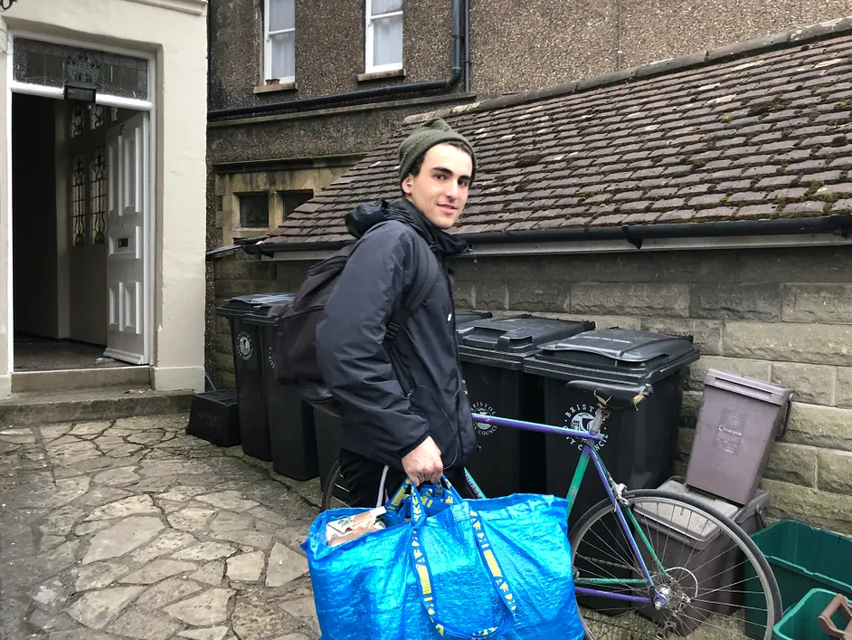 A hotbe team member carrying an IKEA bag with materials.